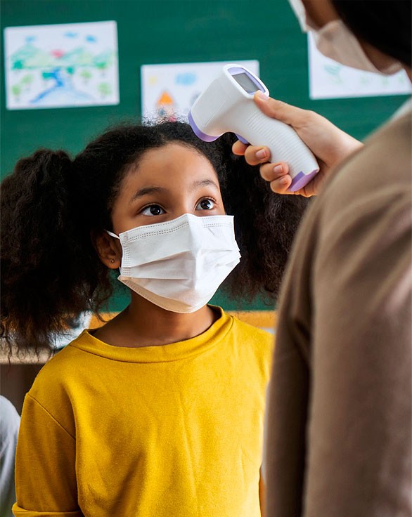 Stock Image of Teacher Scanning Student with Covid Machine